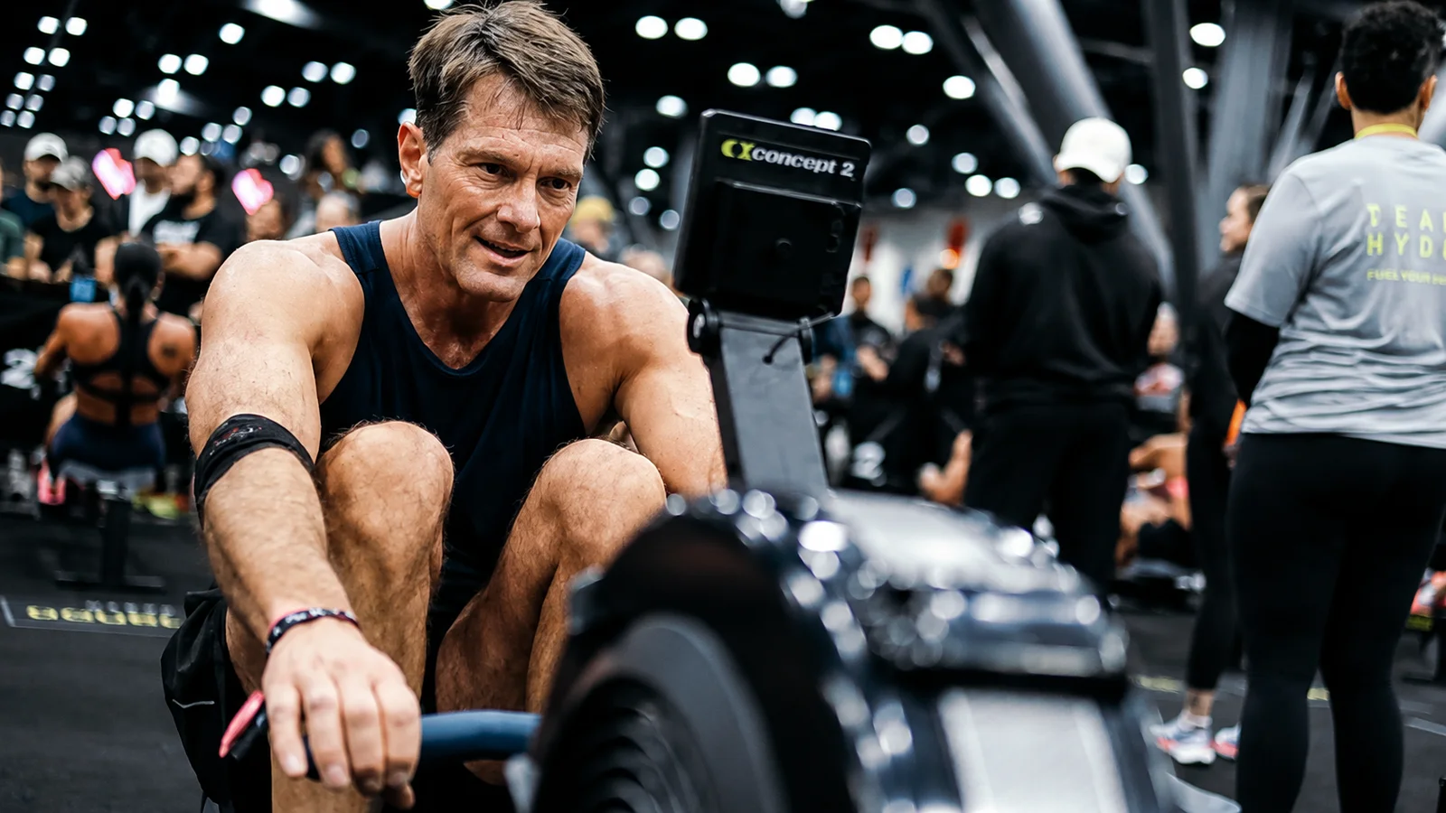 Hyrox athlete pulling hard on a Concept2 rower at True Grit Fitness in Edmond, Oklahoma