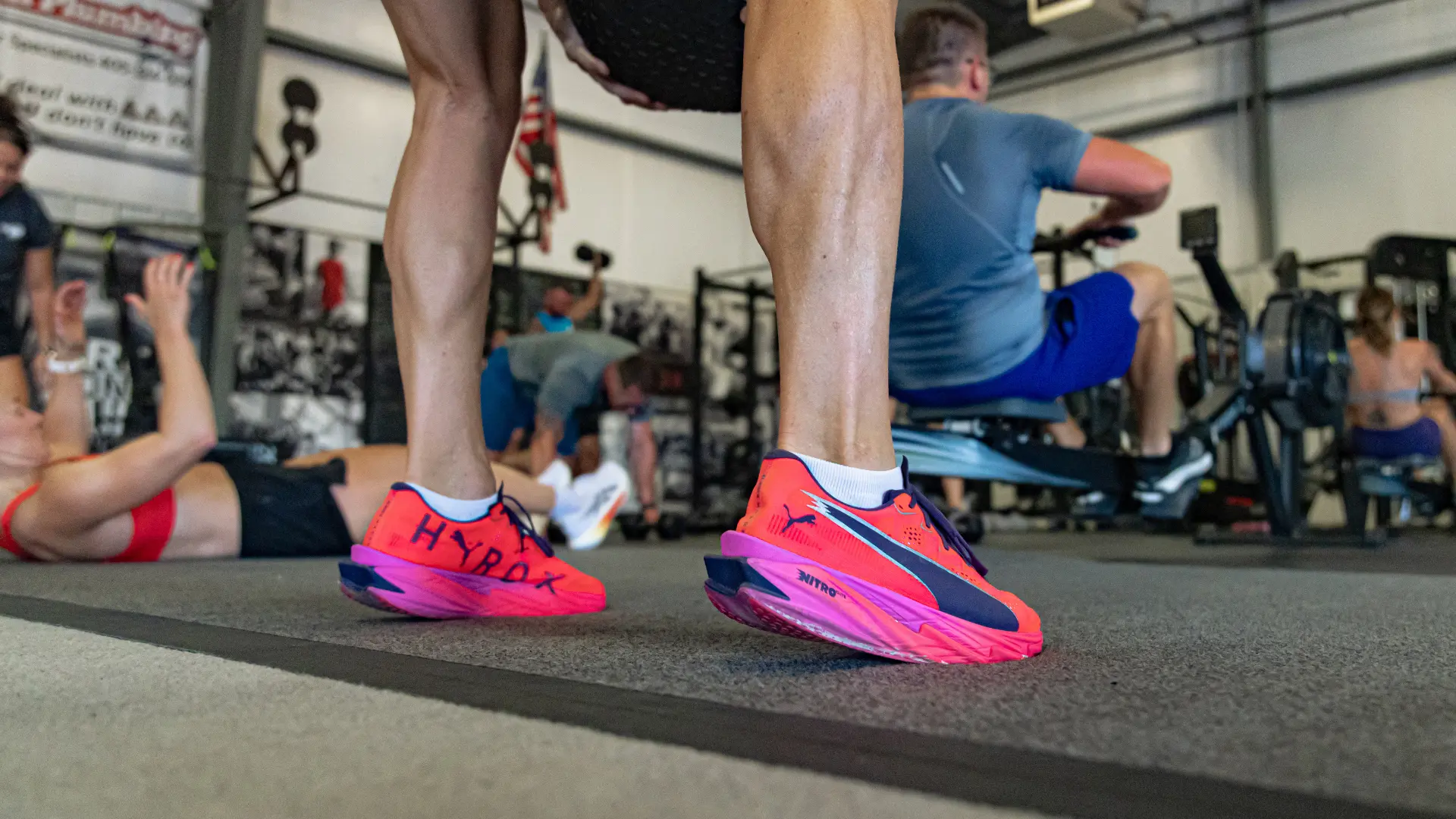 Athletes lined up at the start line of a Hyrox Sprint at True Grit Fitness in Oklahoma City