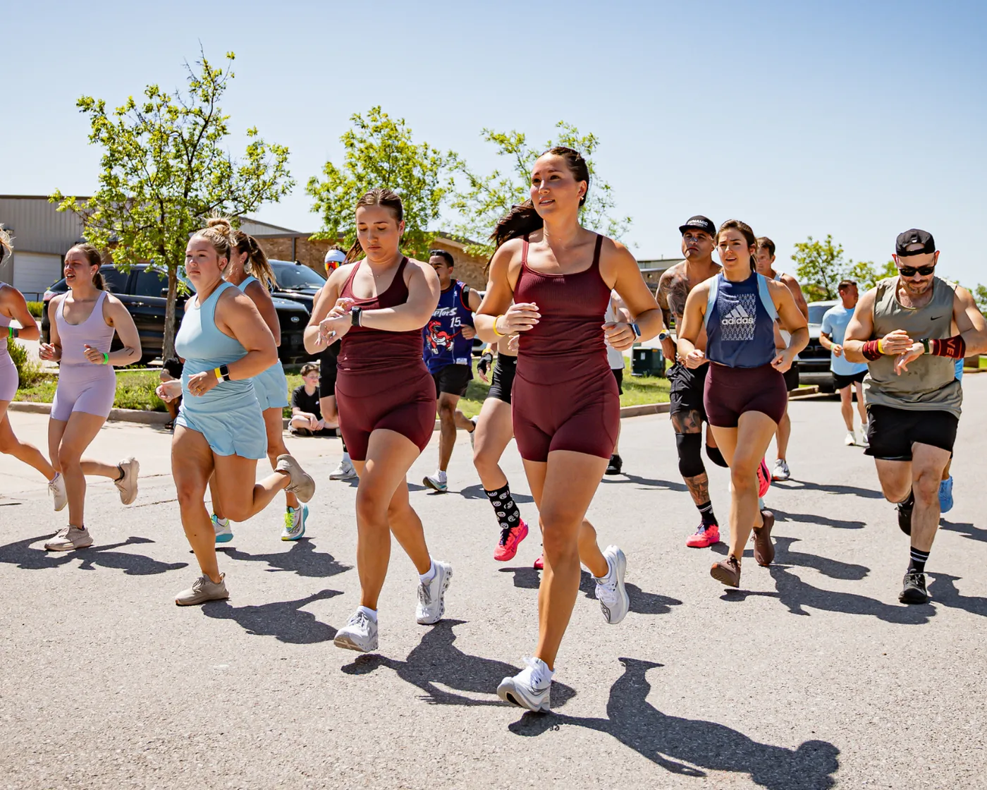 Athletes running the outdoor course at a Hyrox Sprint hosted by True Grit Fitness in Oklahoma City